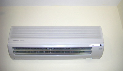 Wall Mounted Air Conditioner Controlled by Remote Control.